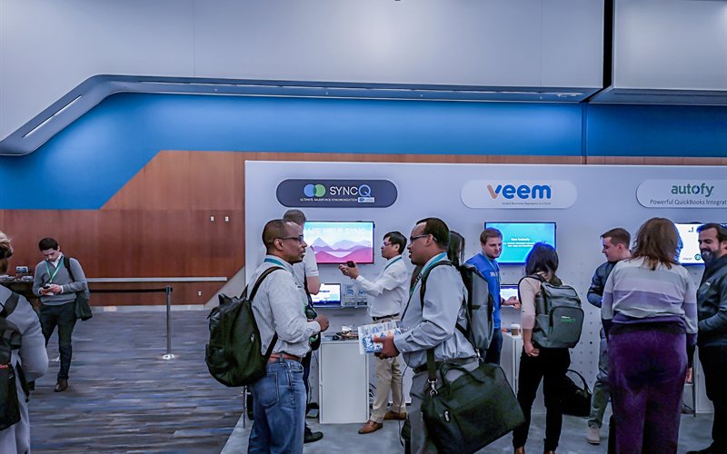 SyncQ booth with multiple visitors