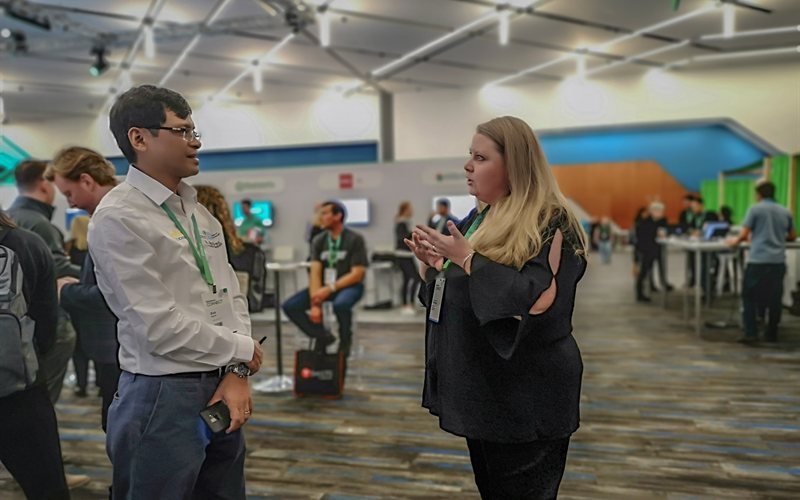 Team member networking at conference