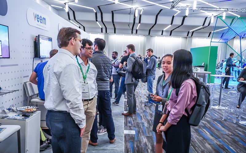 SyncQ team chatting with attendees